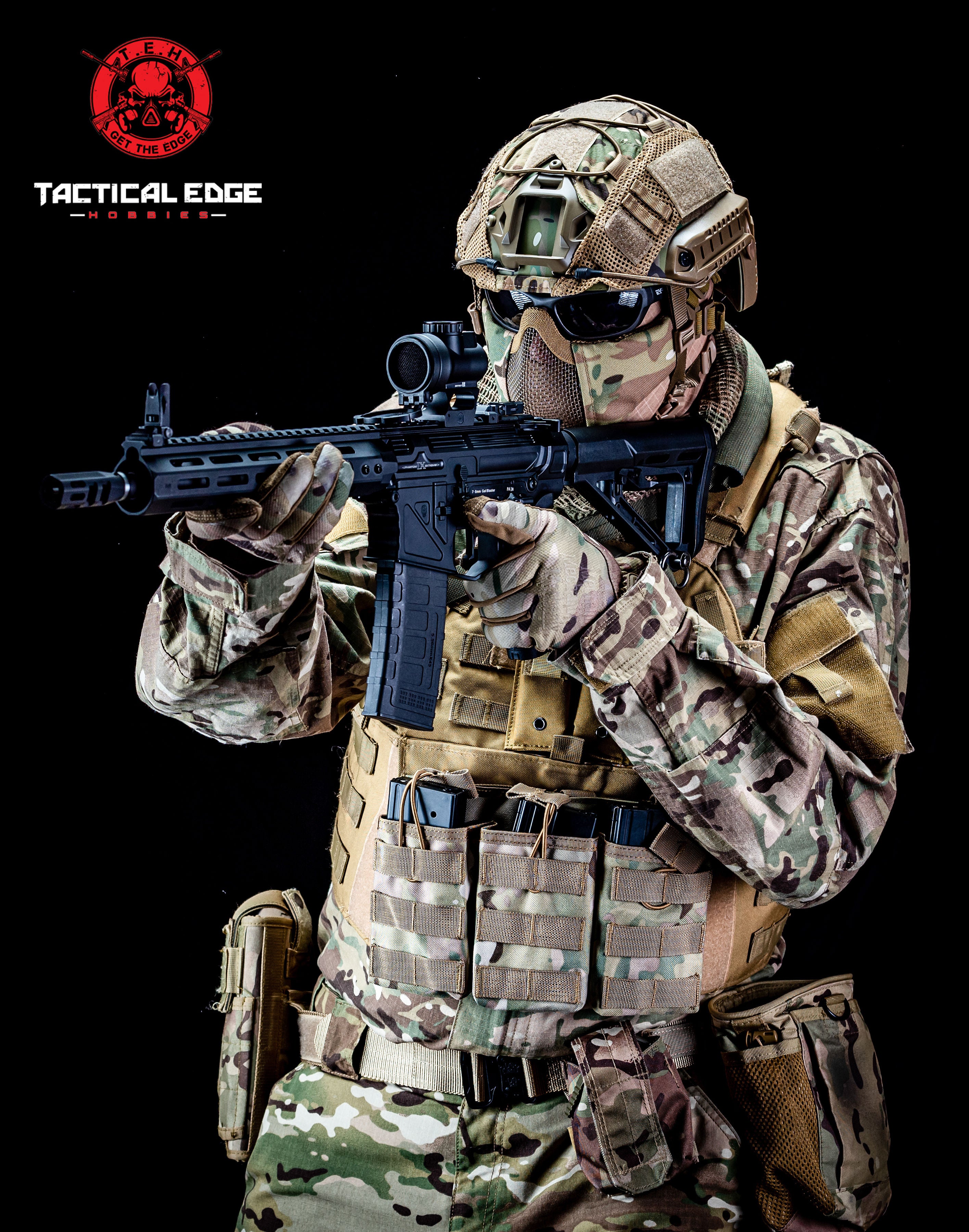 Person in full tactical gear holding a rifle with 'Tactical Edge' logo.