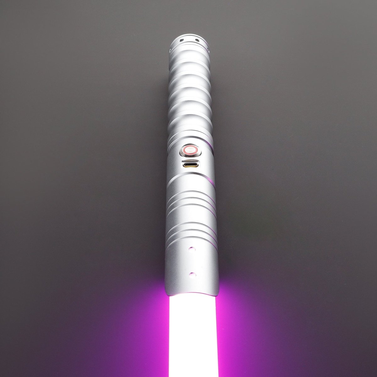 Side view of silver Commander Light Saber glowing brightly - Tactical Edge Hobbies