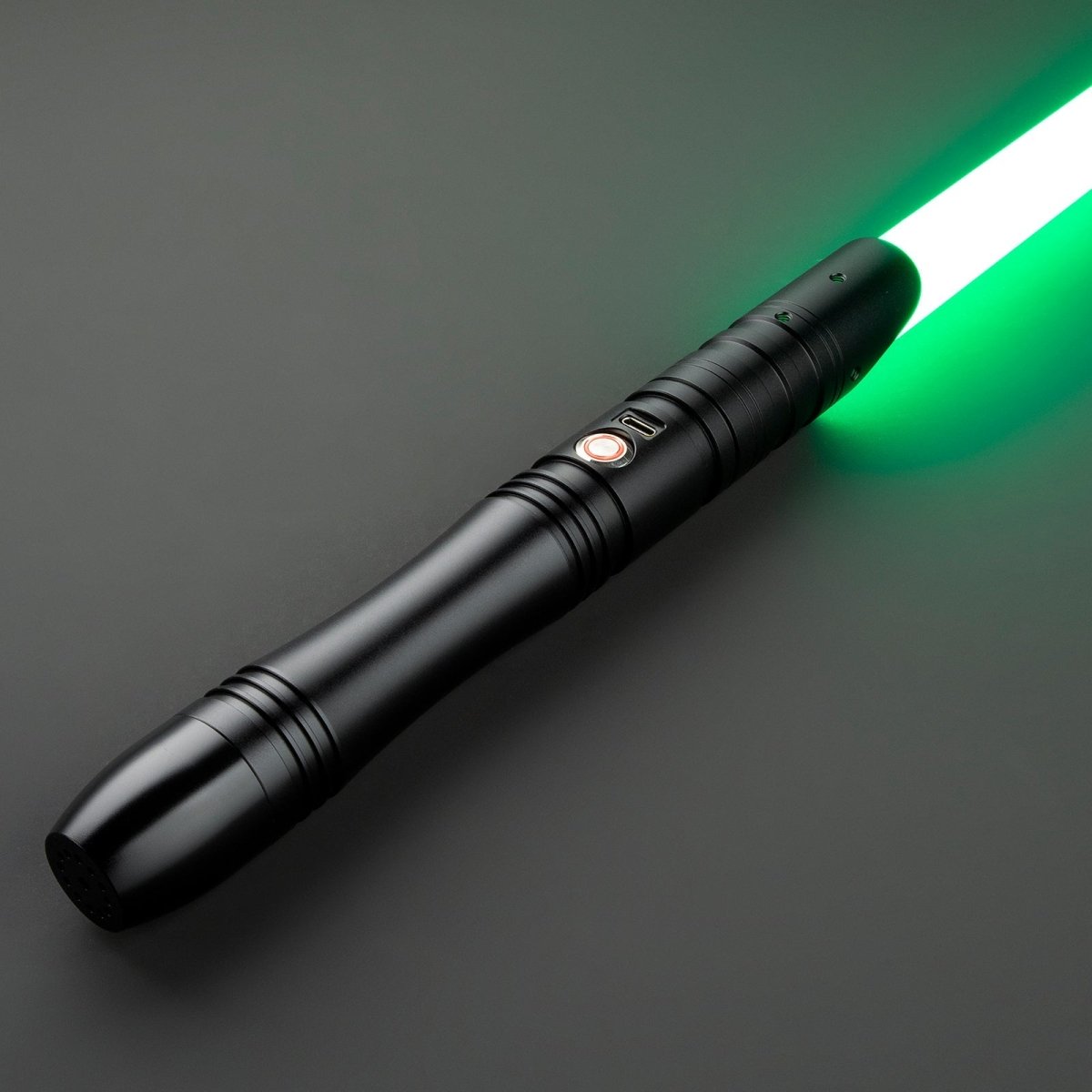 Jovian Light Saber glowing brightly in a dark room - Tactical Edge Hobbies