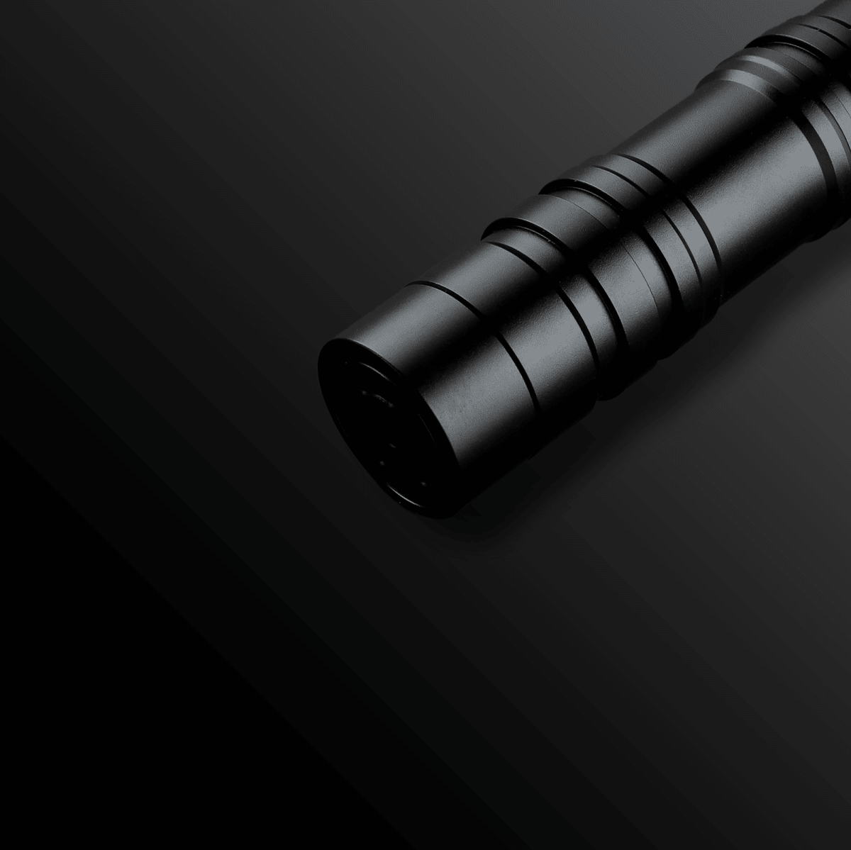 Monolith Light Saber glowing brightly in a dark setting - Tactical Edge Hobbies