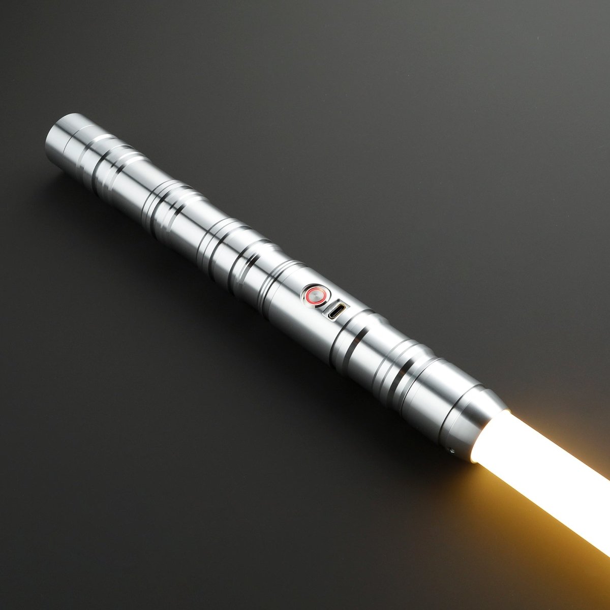 Monolith Silver Light Saber resting on a smooth surface - Tactical Edge Hobbies