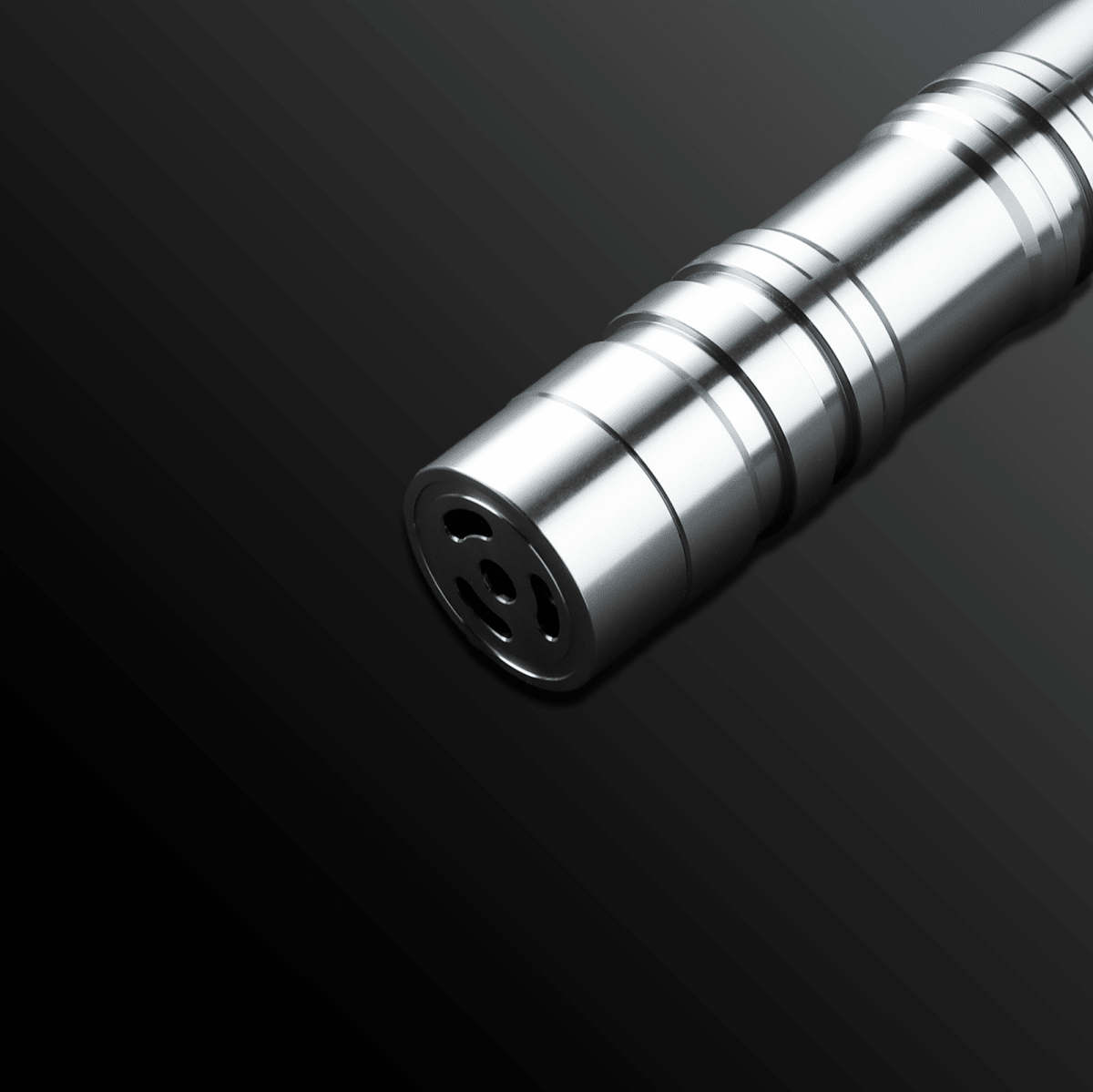 Monolith Silver Light Saber glowing brightly in a dark room - Tactical Edge Hobbies